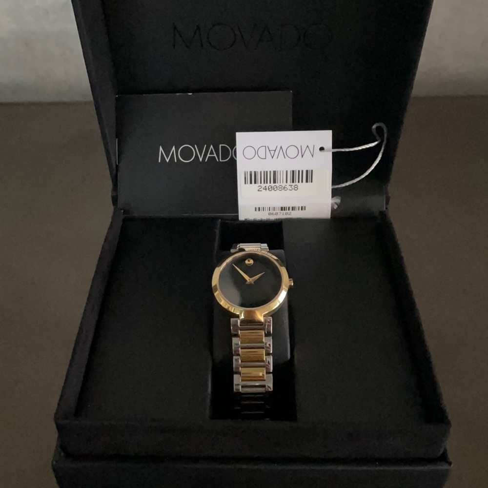 MOVADO gold and silver watch with black face